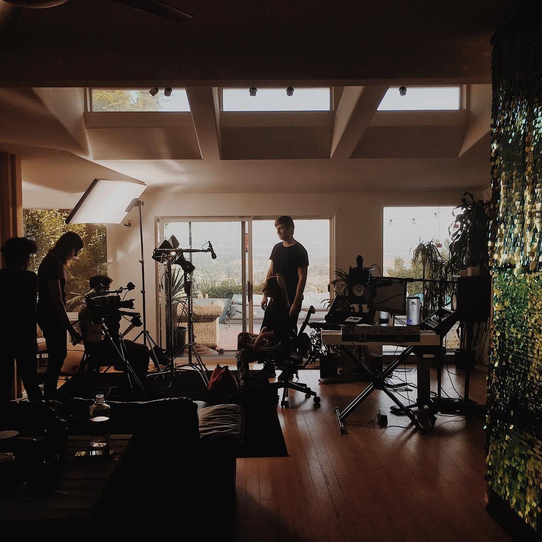 Behind the scenes on a music shoot in a living room studio